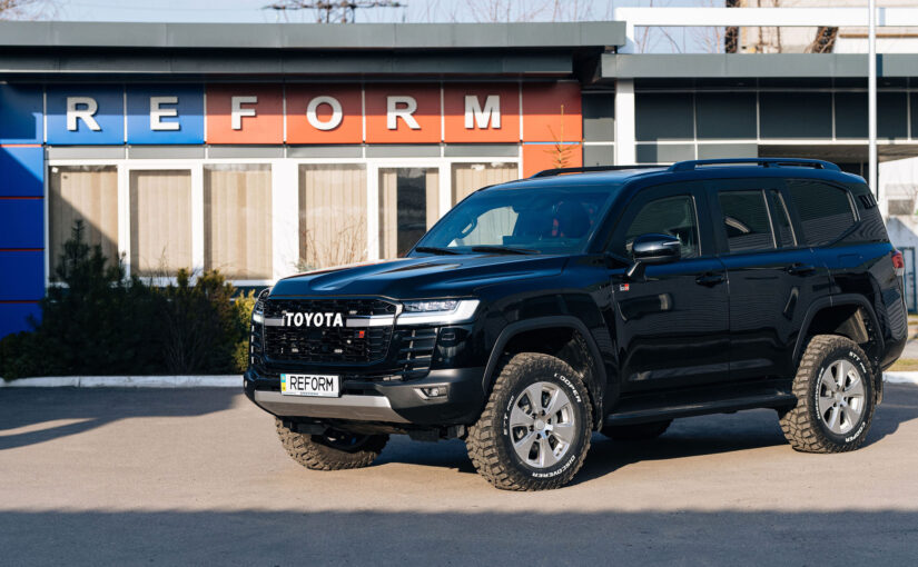 Armored Toyota Land Cruiser 300 GR near the REFORM production facility — front and side view