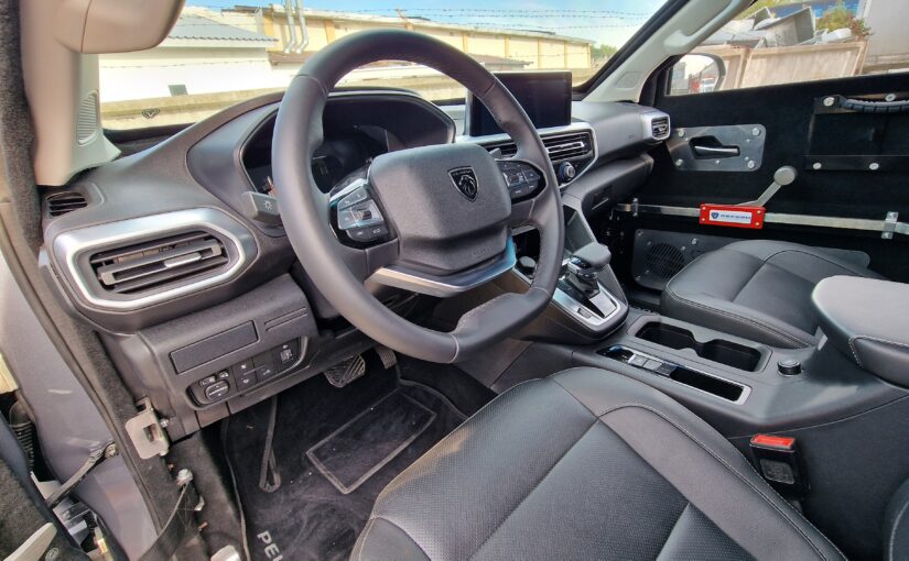 Driver's seat of an armored Peugeot Landtrek in maximum configuration